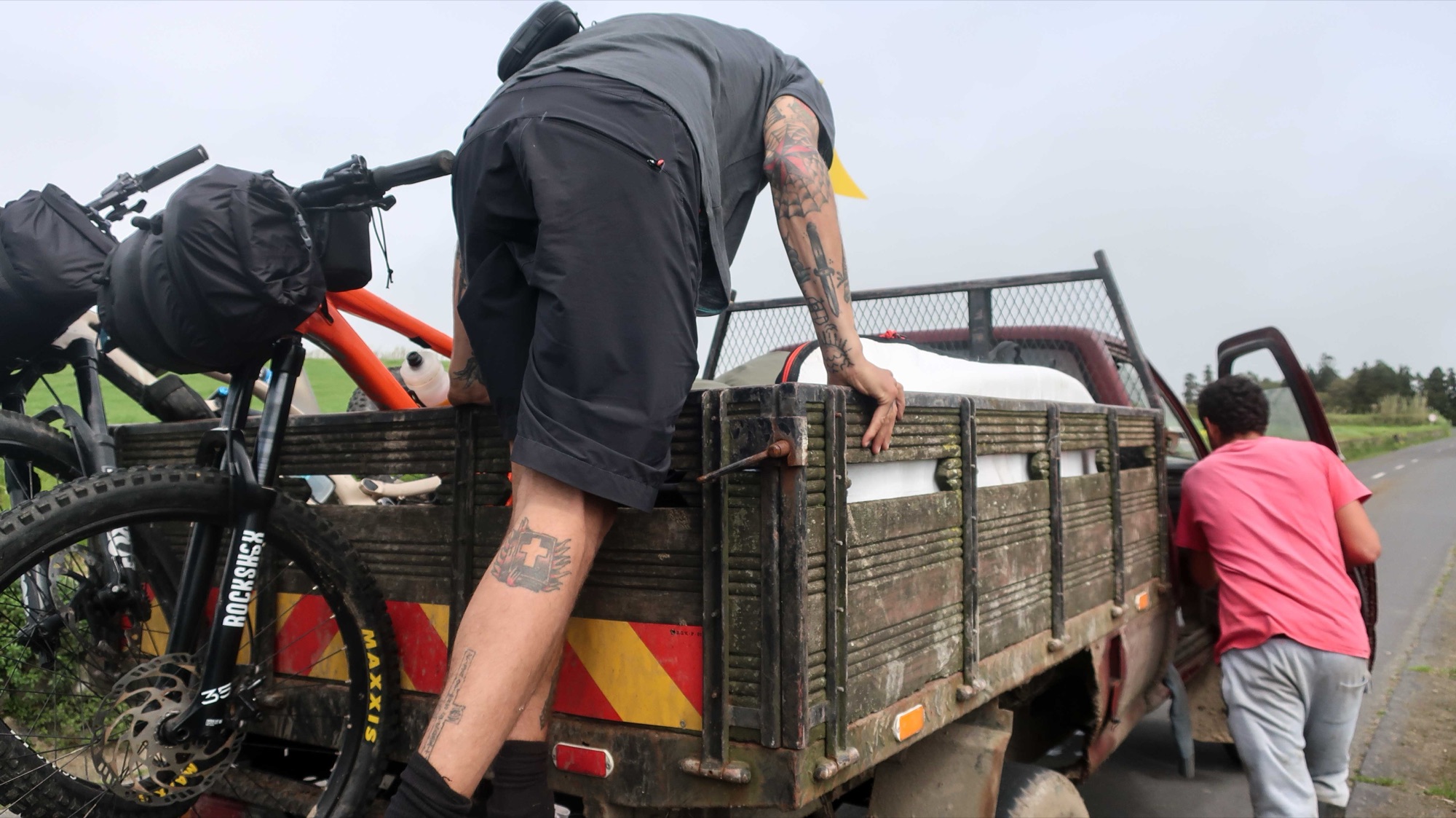 Hitching a lift in the back of a pickup over the volcano